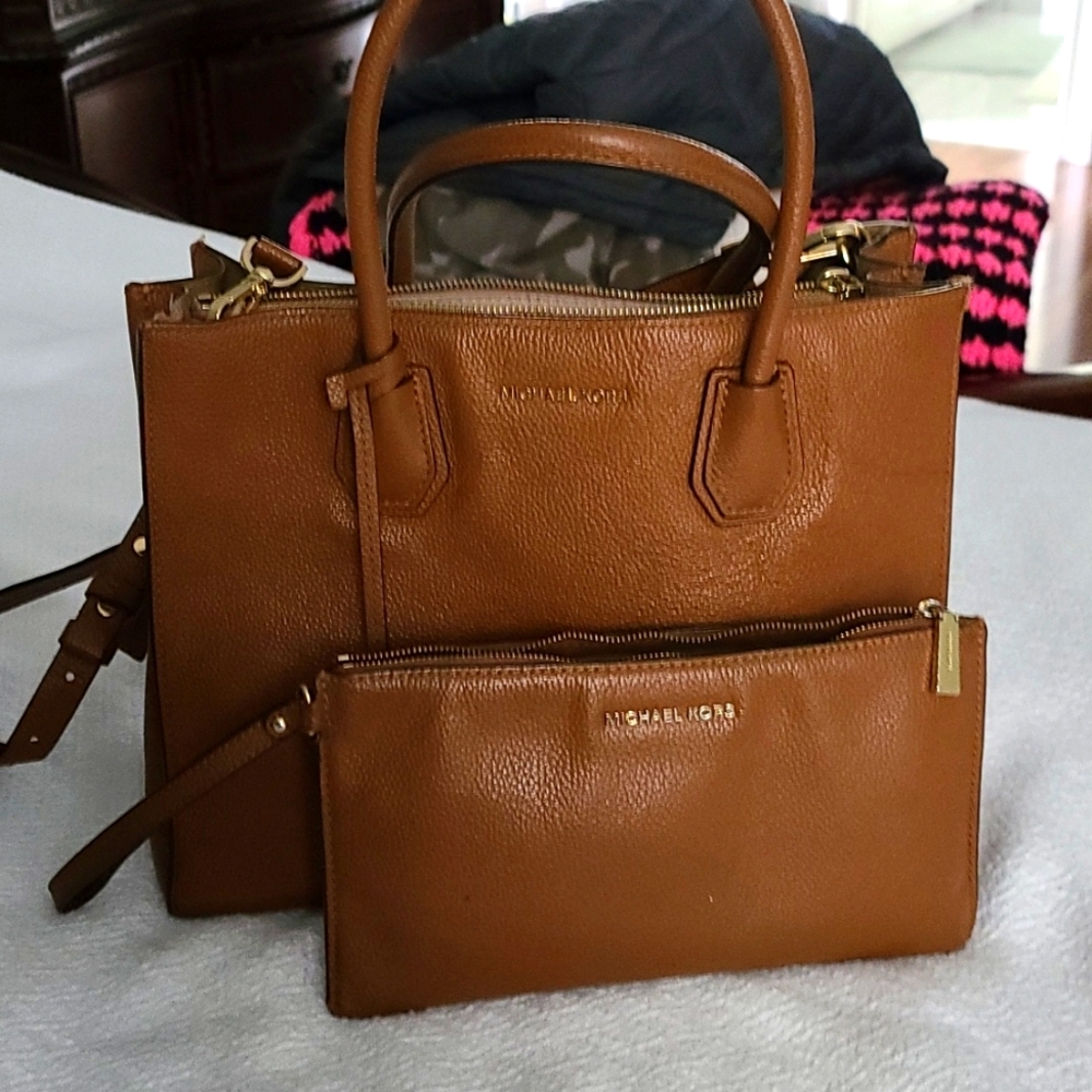 Michael kors wristlet and bag combo up for grabs.